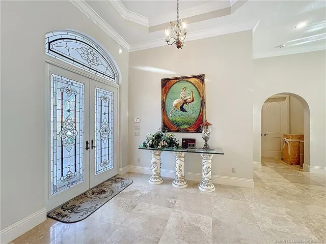 ALL MARBLE FLOORS. DOUBLE ENTRY DOORS ALL IMPACT. DESIGNER GLASS. WHAT A BEAUTY