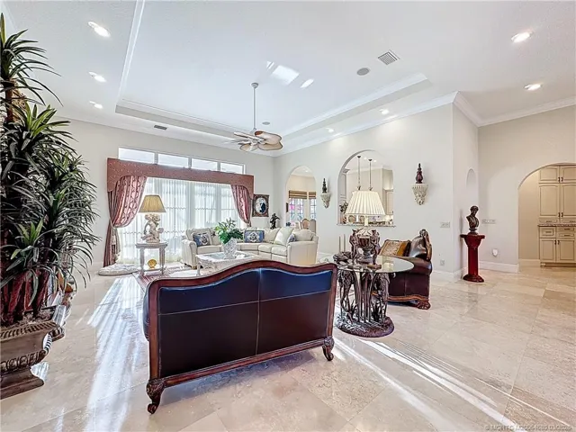 ALL MARBLE FLOORS SO LIGHT AND AIRY. FLOWS TO DININGROOM, KITCHEN WITH PASS THROUGH. LLOK AT THE BEAUTY OF THE CEILINGS AND HOW HIGH THEY ARE. THE WINDOW WITH THE CURTINS ARE SLIDERS OUT THE THE OVERSIZED PATIO AND POOL AREA WITH SUMMER KITCHEN AND BAR AREA. LOTS OF POCET LIGHTING.