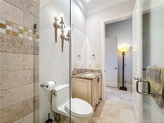 JACK AND JILL BATHROOM WITH ONE OF THE BEDROOMS HAS A SHOWER NO TUB. IT CLOSES OFF FOR YOUR GUEST TO HAVE PRIVACY, WHILE STAYING WITH YOU. BEAUTIFUL TILE CROWN MOLDING GRANITE COUNTERS