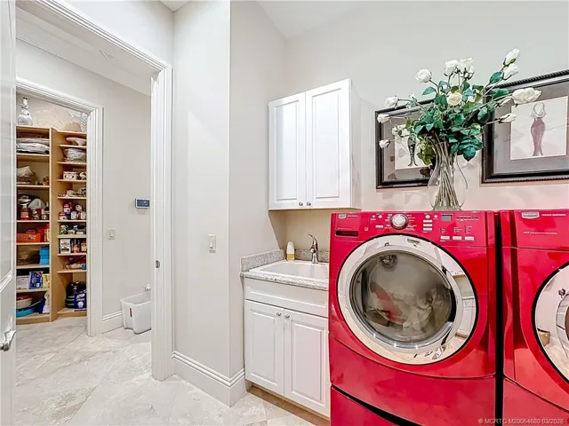 It has it all and included is the front load washer and dryer. lots of storage and counter tops. To the left is the walk in Pantry. wow