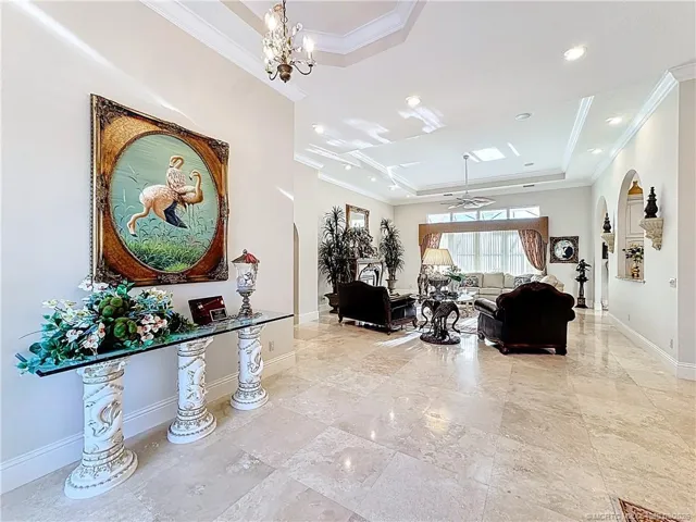 All marble floors, crown molding, high ceilings, tray ceilings so much design and beauty, looks out over the patio and pool area ,you are on the 9th hole.