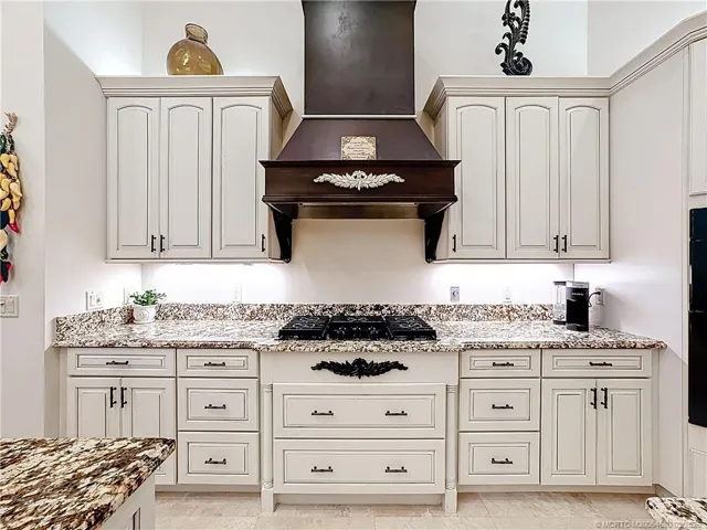 Gas stove 5 burners, vents out, granite counter tops, double sinks and 2 islands to have room to work.