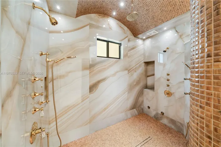 Walk-in shower designed to be easily converted into a steam room.