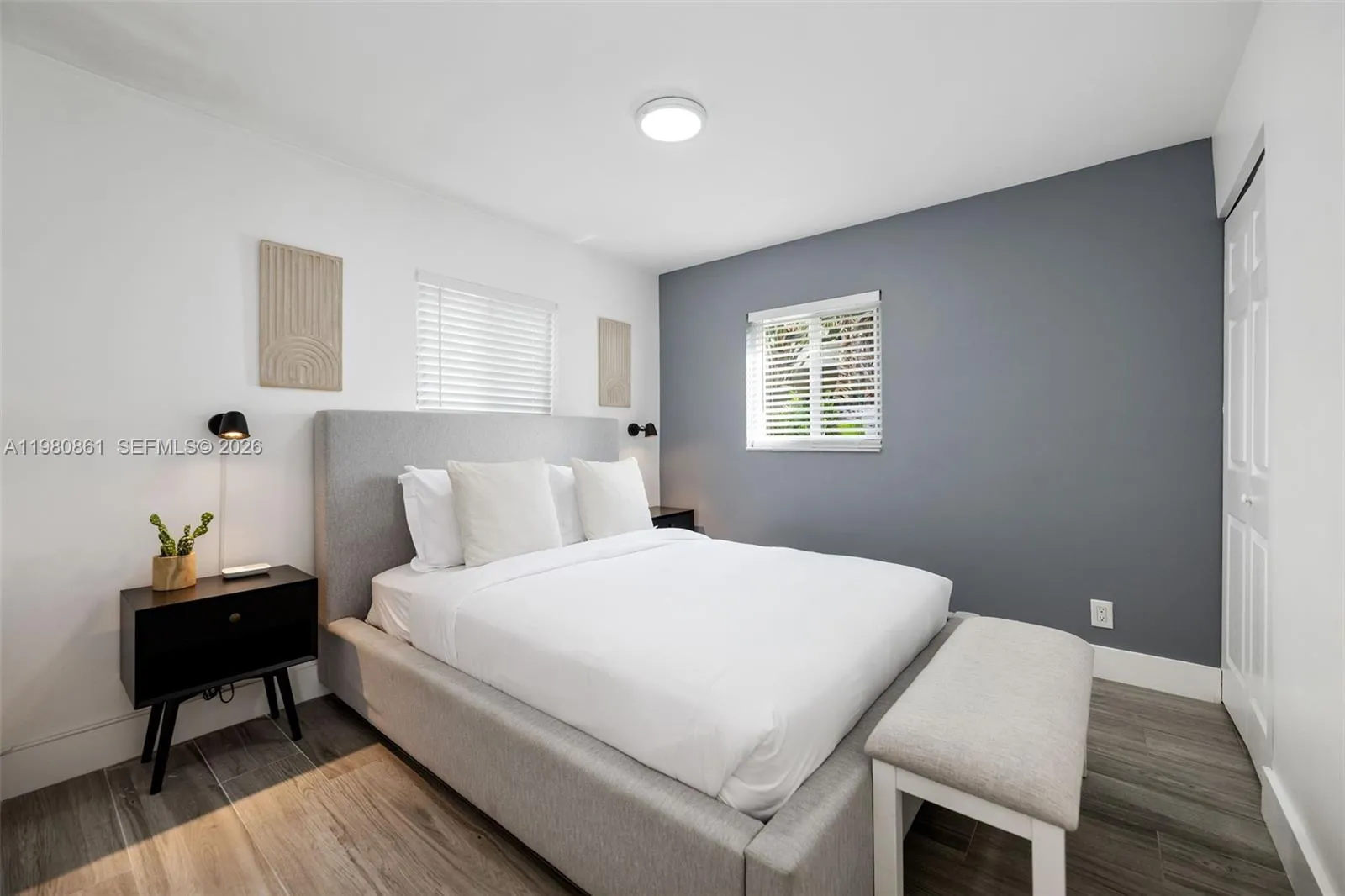 #4. Stylishly appointed bedroom featuring a designer accent wall, plush upholstered bed, and refined modern finishes—offering a tranquil retreat that blends comfort, sophistication, and timeless appeal