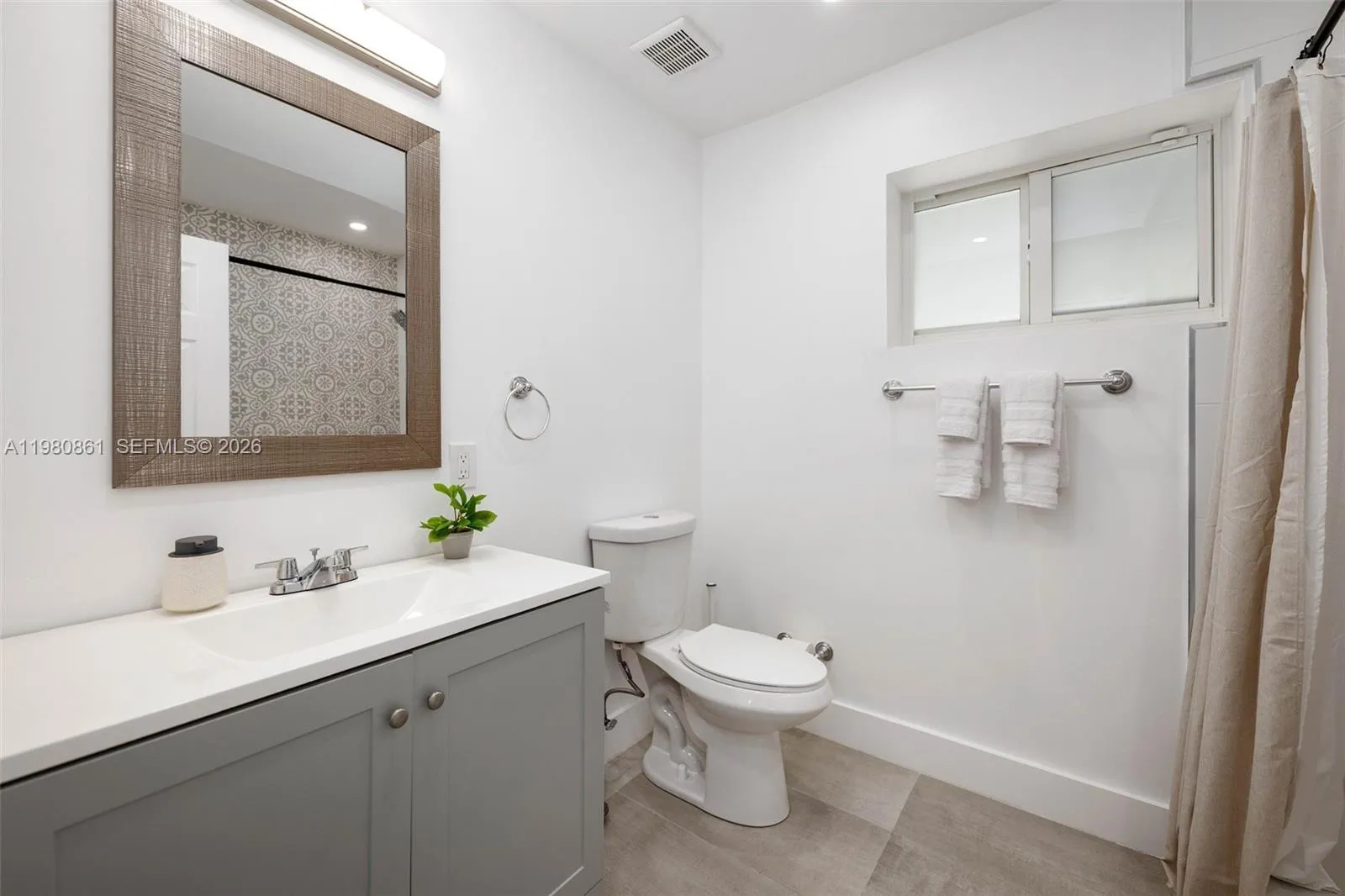 to Master Bedroom with elegant spa-style bathroom showcasing refined finishes, designer vanity, and a light-filled layout—offering a serene experience with timeless sophistication