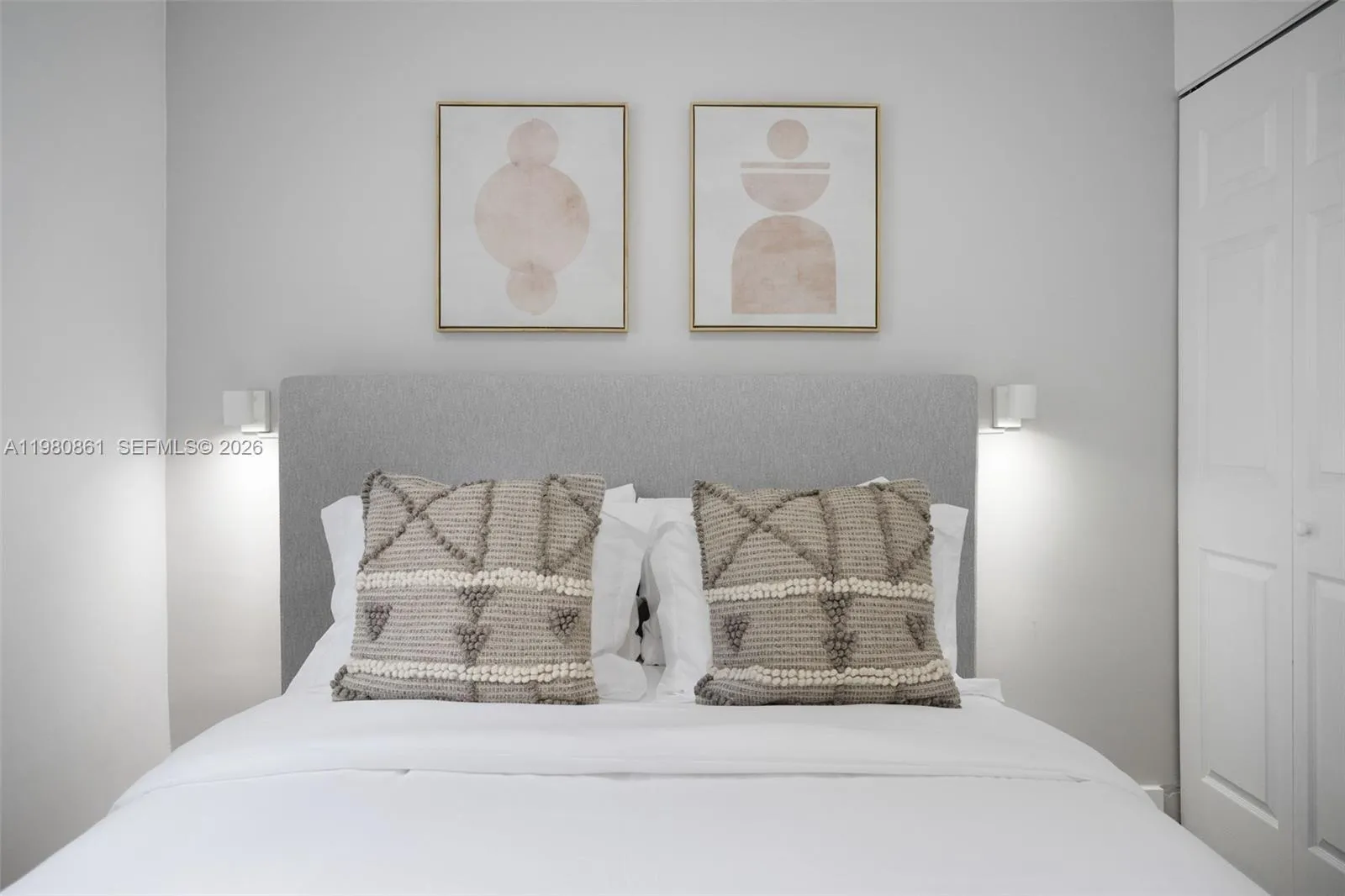 #2. Elegant bedroom sanctuary highlighted by a plush upholstered headboard, curated designer accents, and soft neutral tones—offering a serene retreat with timeless, sophisticated appeal