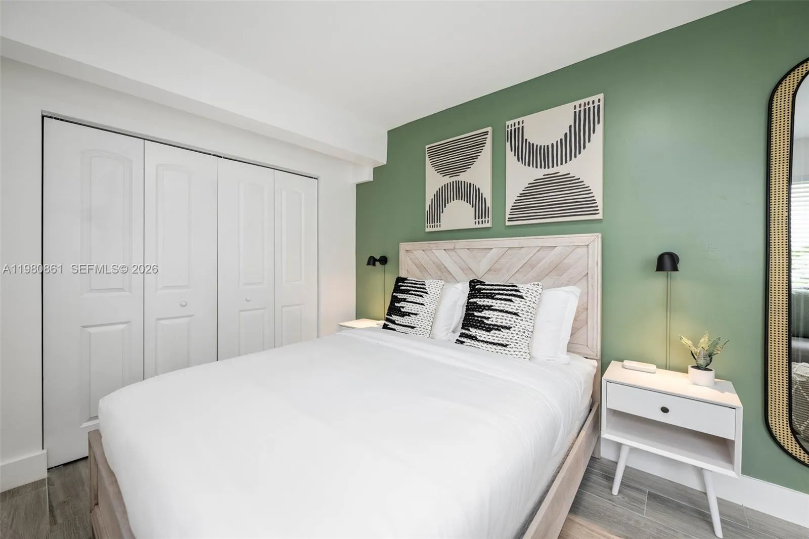 #1. Elegant bedroom retreat showcasing a designer accent wall, custom wood headboard, and curated modern finishes—creating a sophisticated, tranquil space designed for elevated comfort and timeless luxury living
