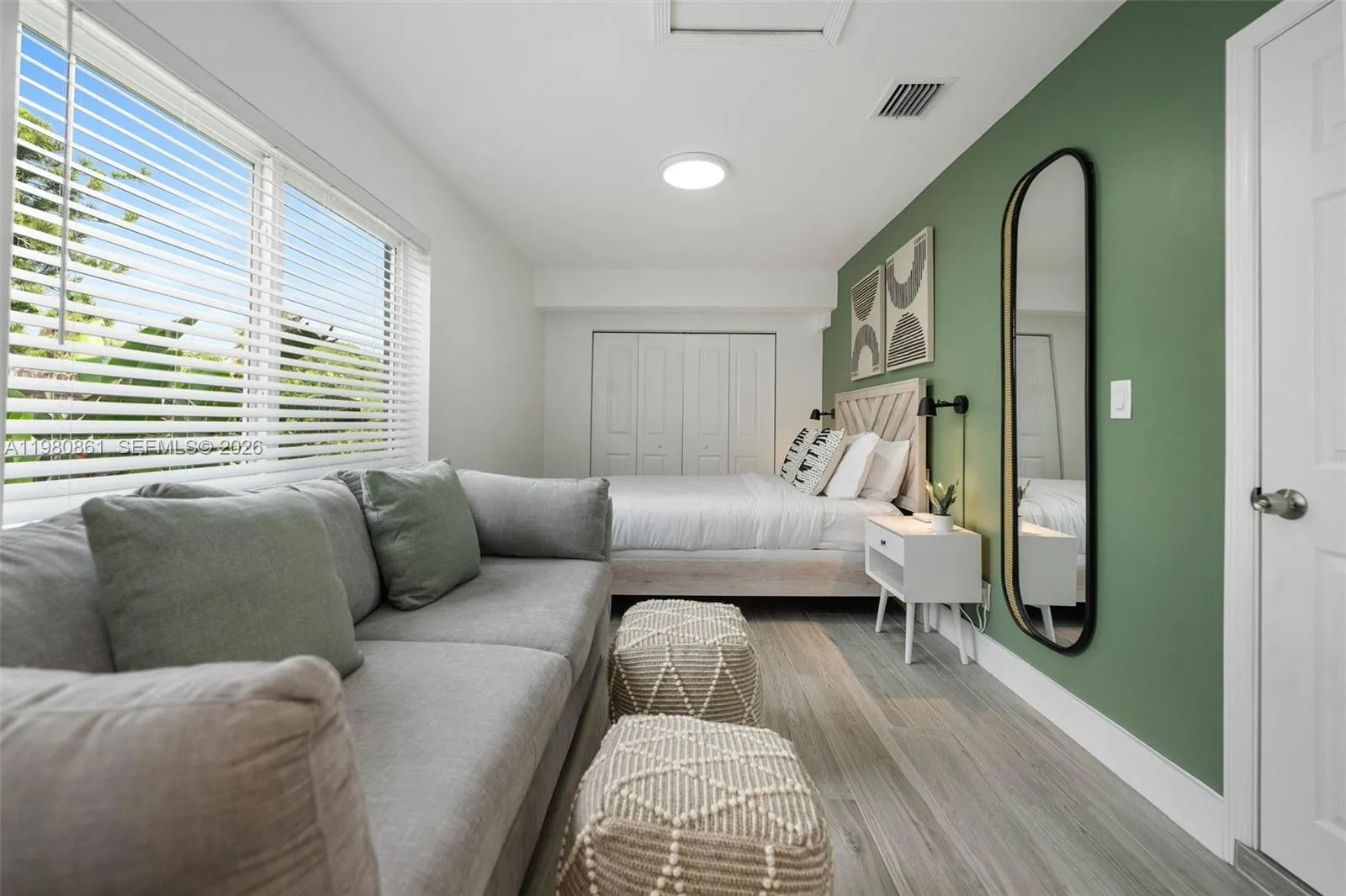 #1. Master bedroom with private bathroom. An impeccably designed bedroom suite offering refined comfort and versatility, featuring designer finishes, a sophisticated accent wall, and abundant natural light—an elegant retreat crafted for modern luxury living.