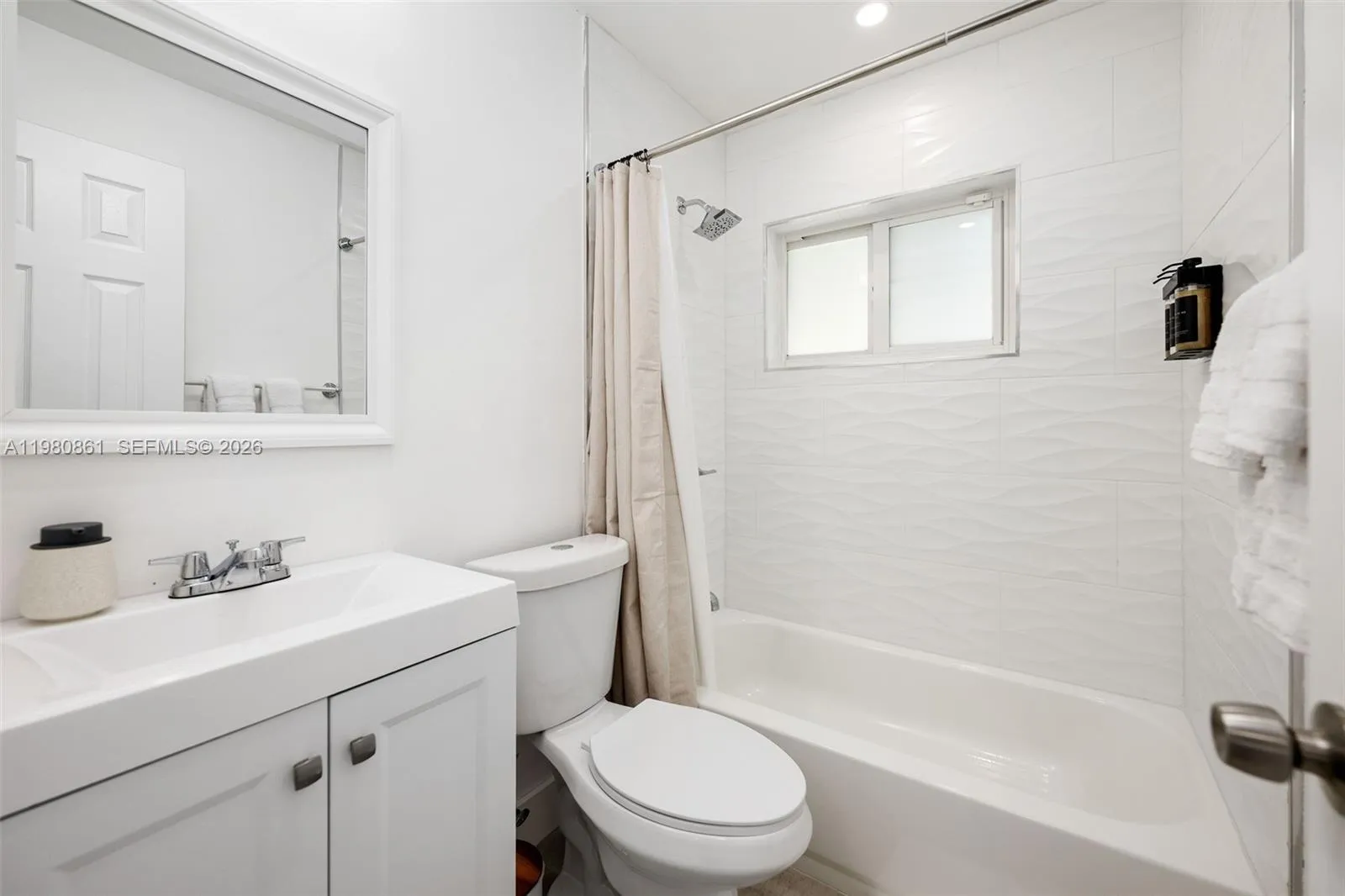 to bedrooms and common area with spa-inspired crisp white finishes, elegant tilework, and a light-filled shower—designed to deliver a serene experience with timeless sophistication.