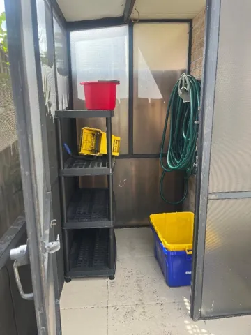 STORAGE AREA IN THE SCREENED PATIO ARE