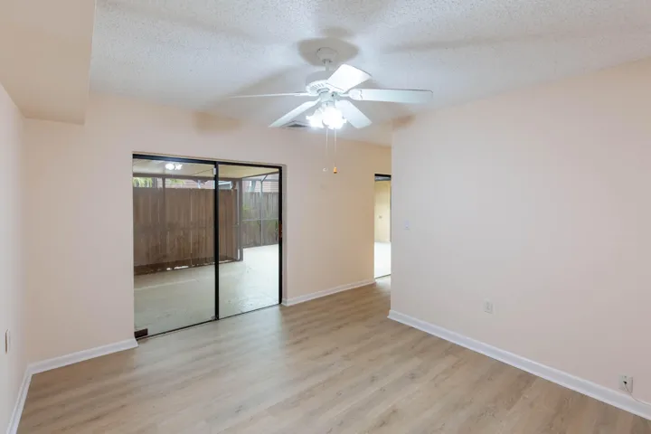 DEN/MANY PEOPLE CONVERTED INTO A BEDROOM BY PUTTING A DOOR, NOTICE THIS DEN HAS SLIDING DOORS TO PATIO AREA
