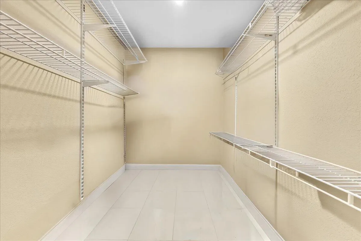 Walk in closet primary bedroom