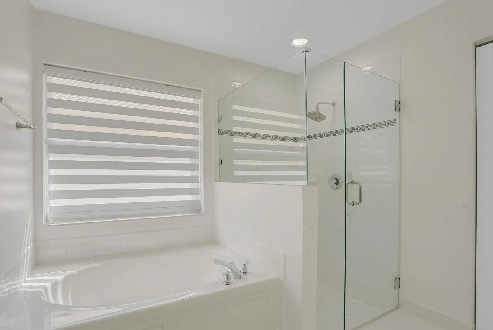 Master Bath with a linen closet and Volume ceilings.