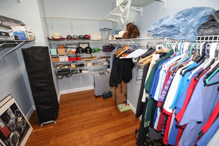 A deep walk in closet is a welcome feature of this home