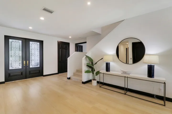 front door and stairs from living room