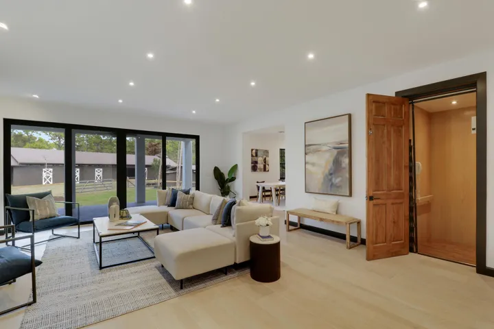 living room showing barn and elevator