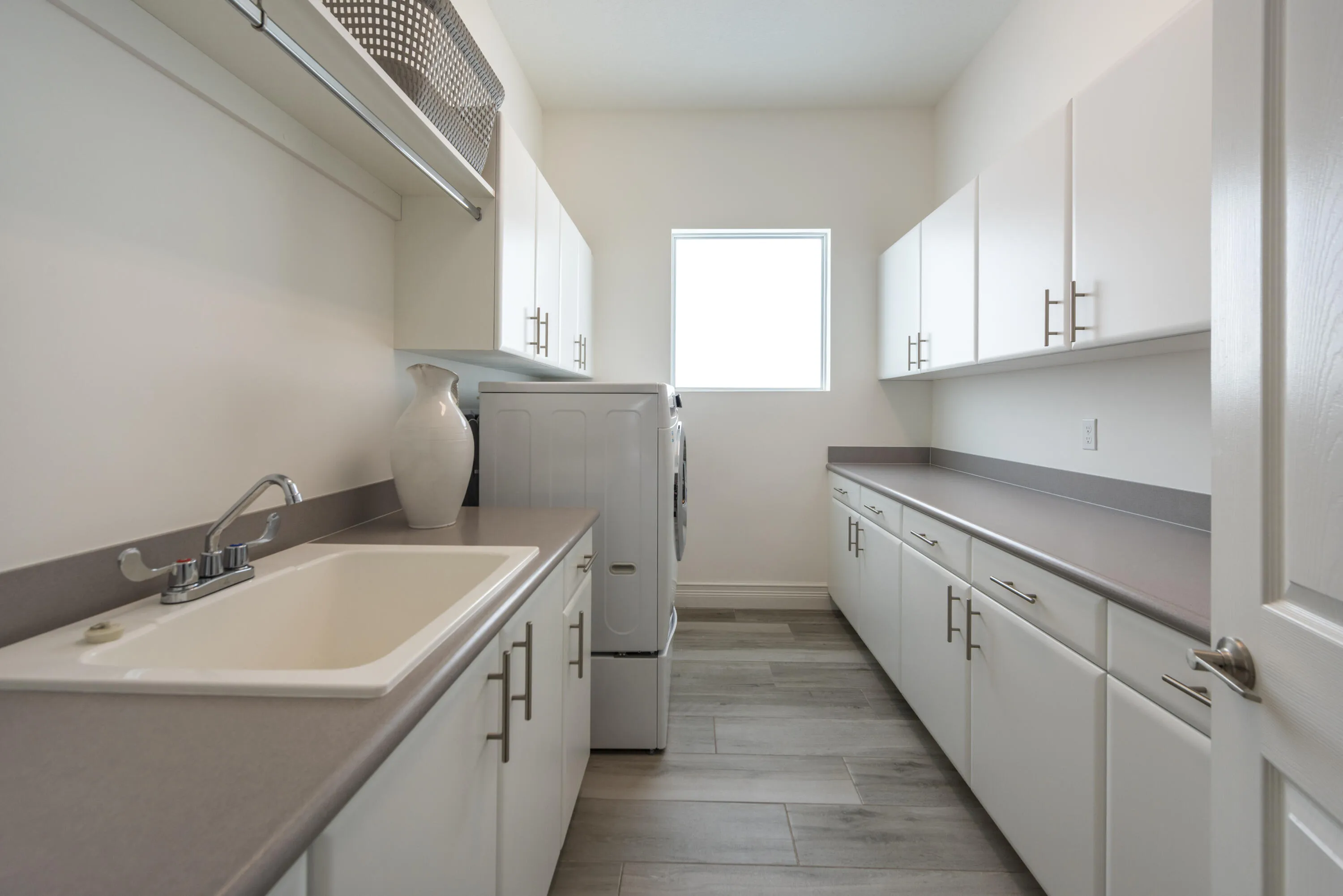Huge laundry room has tons of storage!