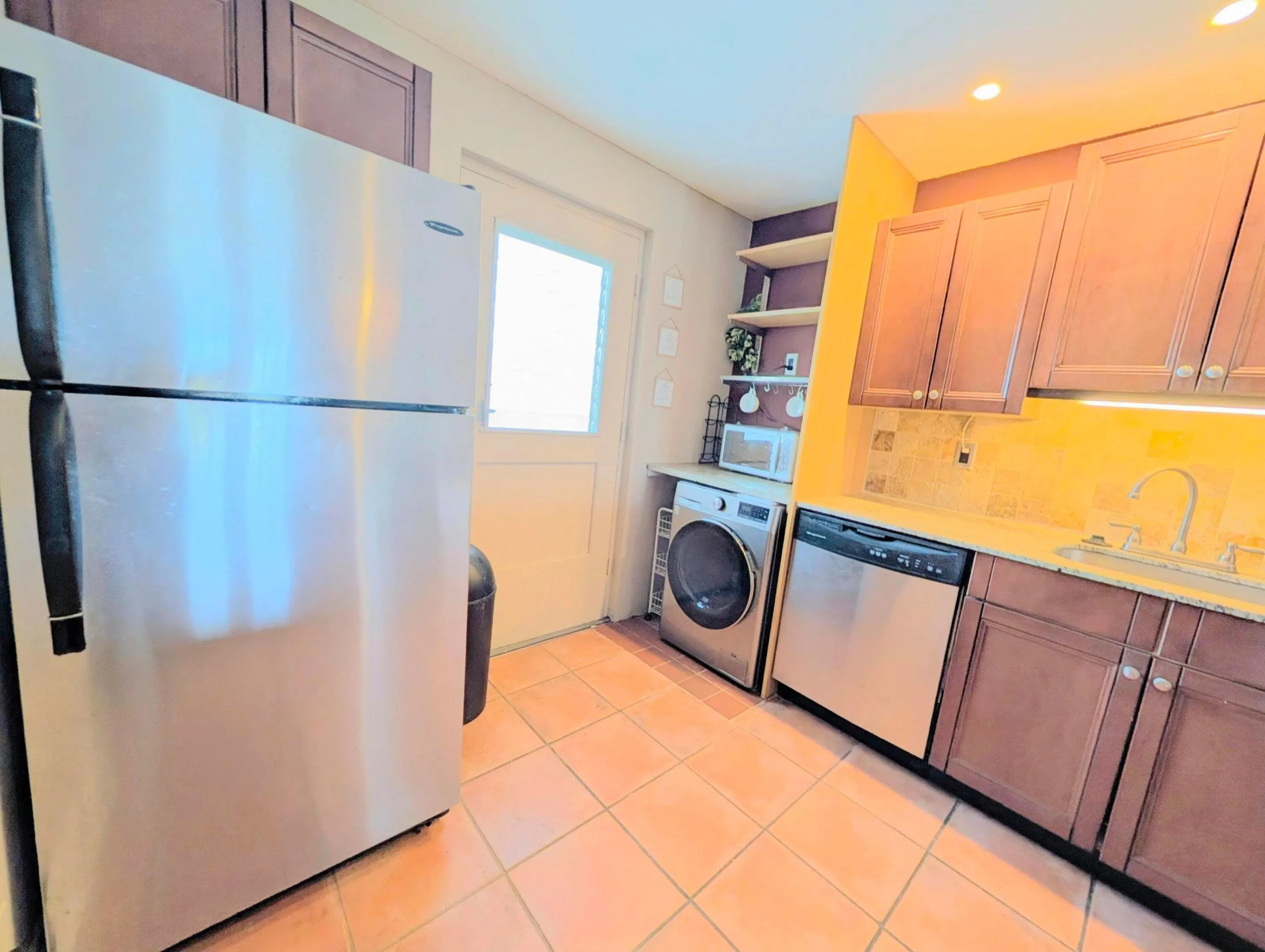 Lots of cabinets and counter space! Convenient new washer/dryer in unit.