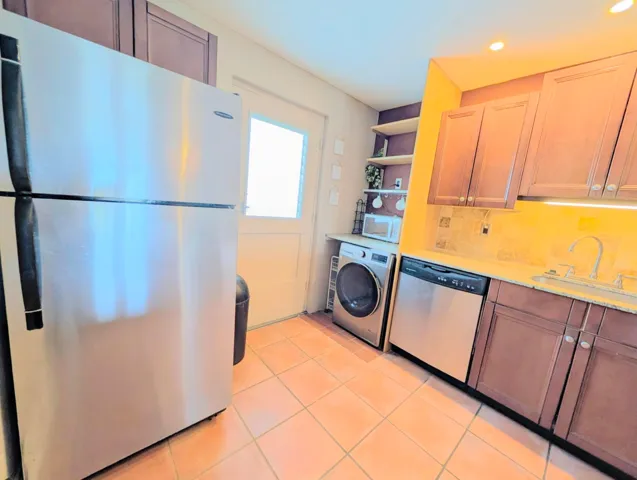 Lots of cabinets and counter space! Convenient new washer/dryer in unit.
