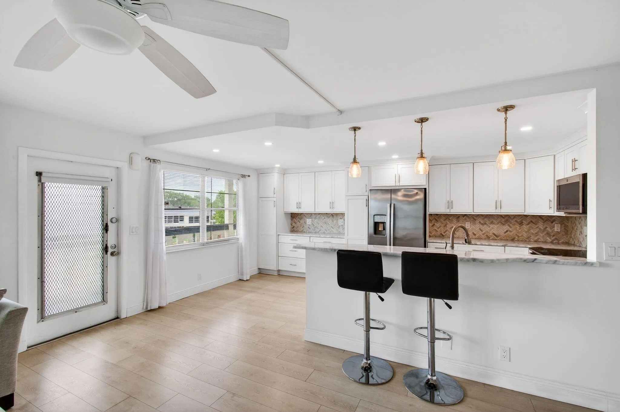 Stylish Pendants over Peninsula seating