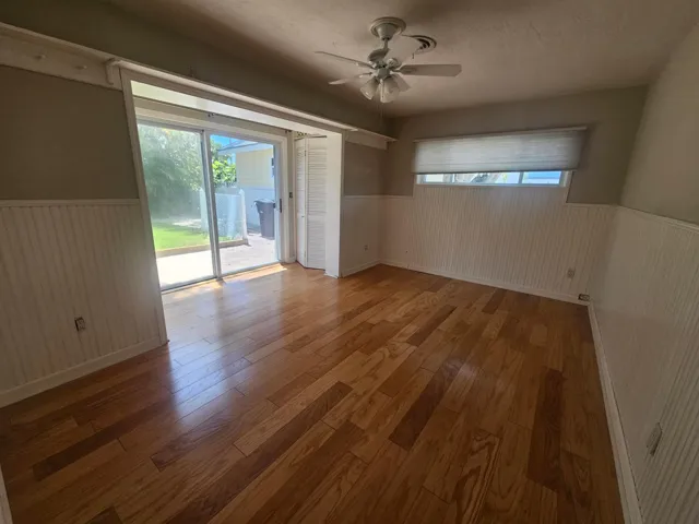 Master bedroom with sliders out to the lush and private backyard!