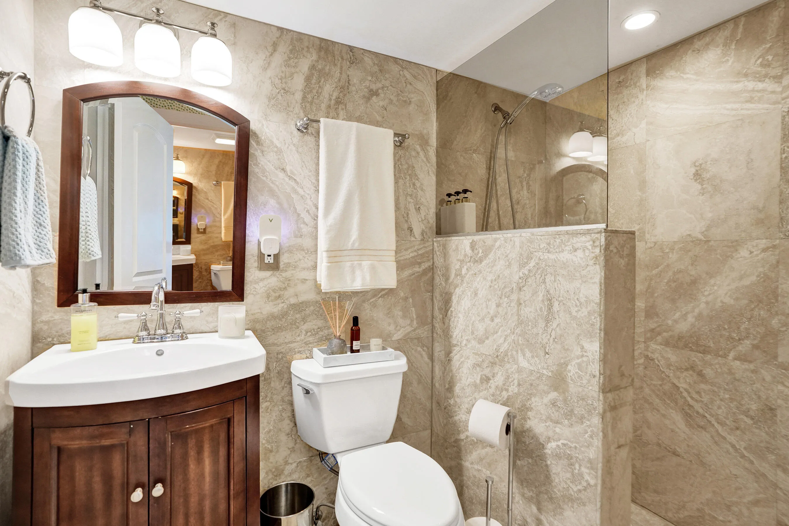 Guest bathroom beautifully appointed with access from bedroom and living room.