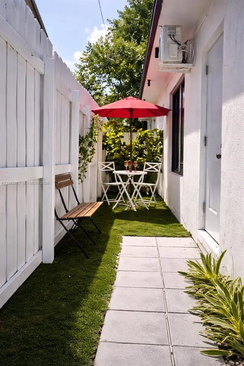 Private Patio Oasis with Wine & Red Umbrella