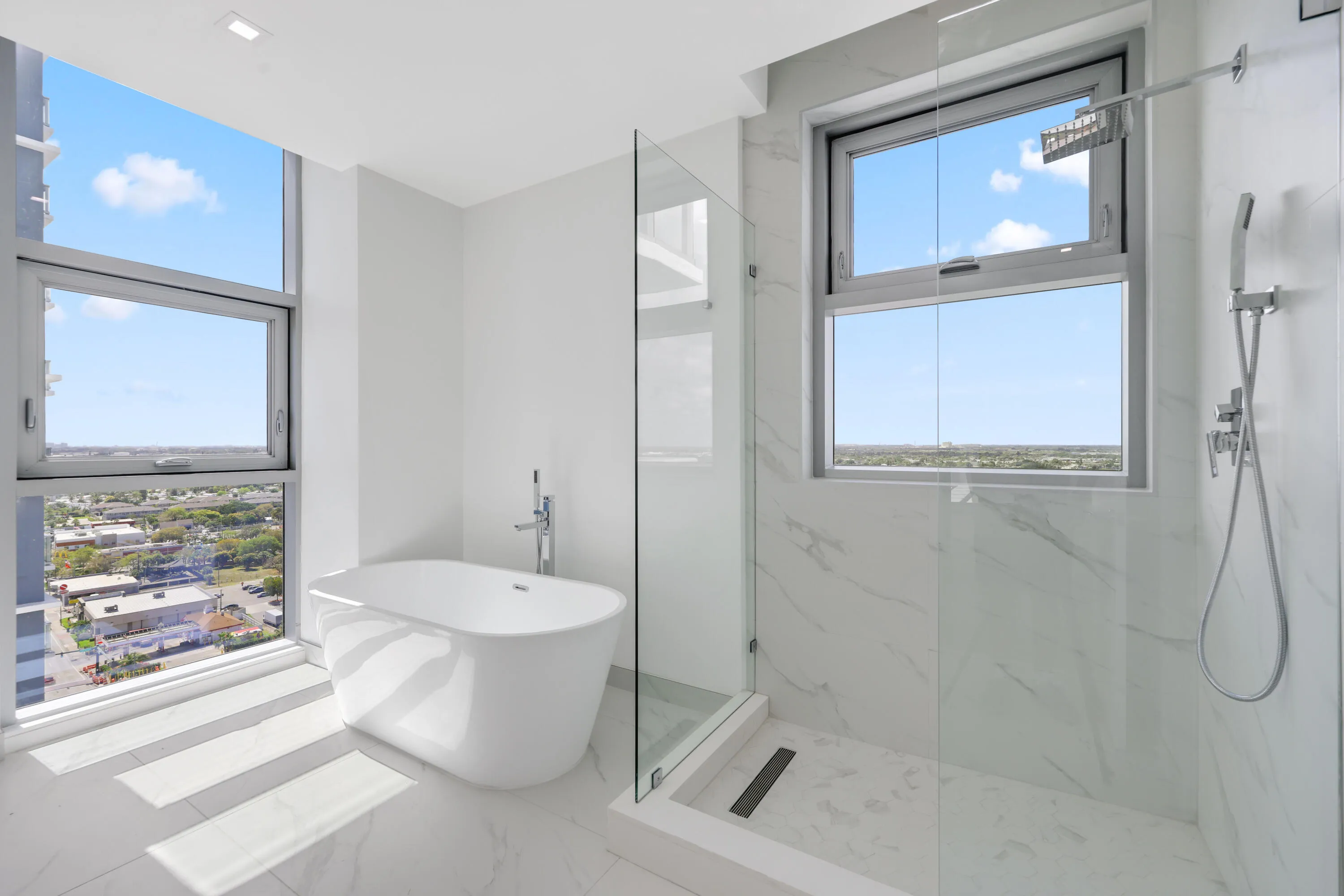 primary suite full bathroom with walk-in shower and tub