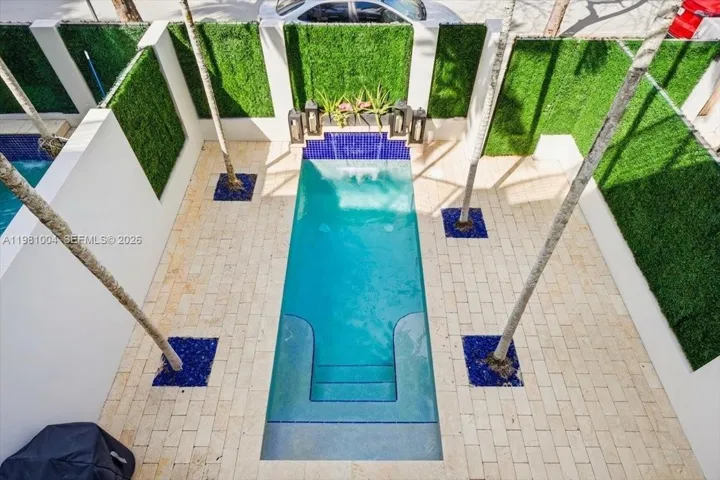 view of pool from primary suite balcony