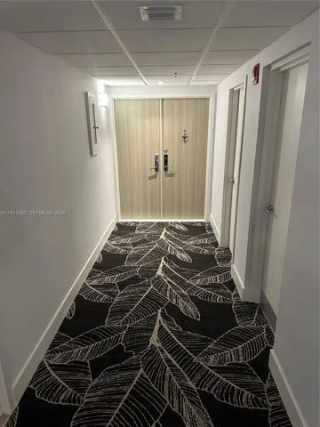 hallway to front door of apartment