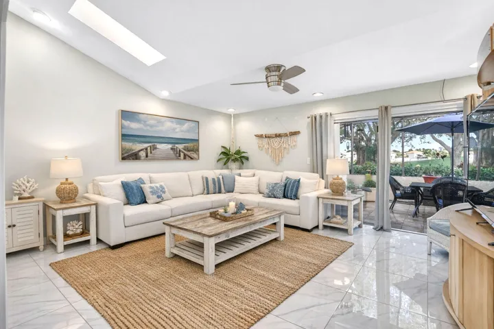 Huge family room designed for modern living features a warm atmosphere, ideal for entertaining.