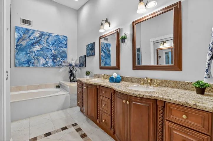 BIG primary bath has a large soaking tub to wash away your worries.