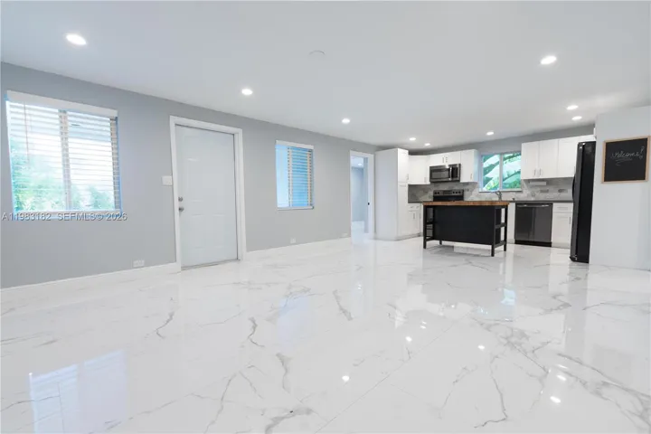 Bright open kitchen, dining, and living area perfect for entertaining.