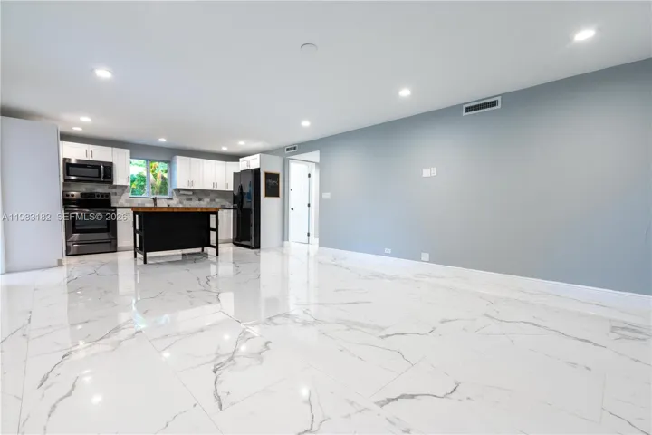Bright open kitchen, dining, and living area perfect for entertaining.