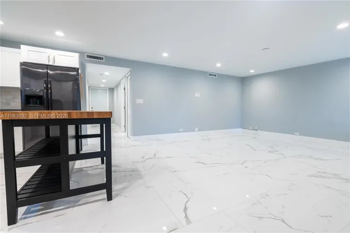 Bright open kitchen, dining, and living area perfect for entertaining.