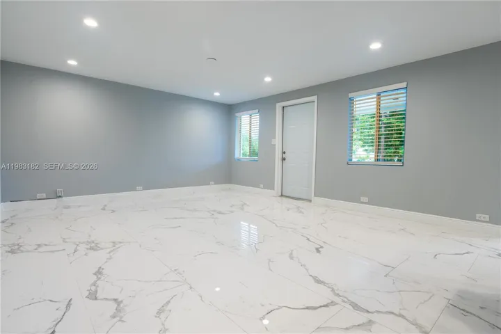 Bright open kitchen, dining, and living area perfect for entertaining.