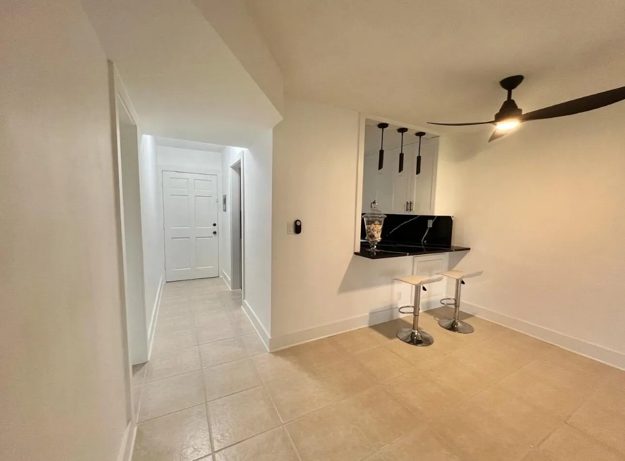 Dining Area and View of Main Entrance Foyer and Breakfast Nook