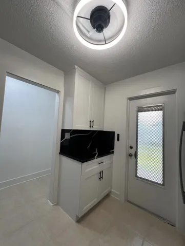 New Kitchen/Door to the Hallway Outside