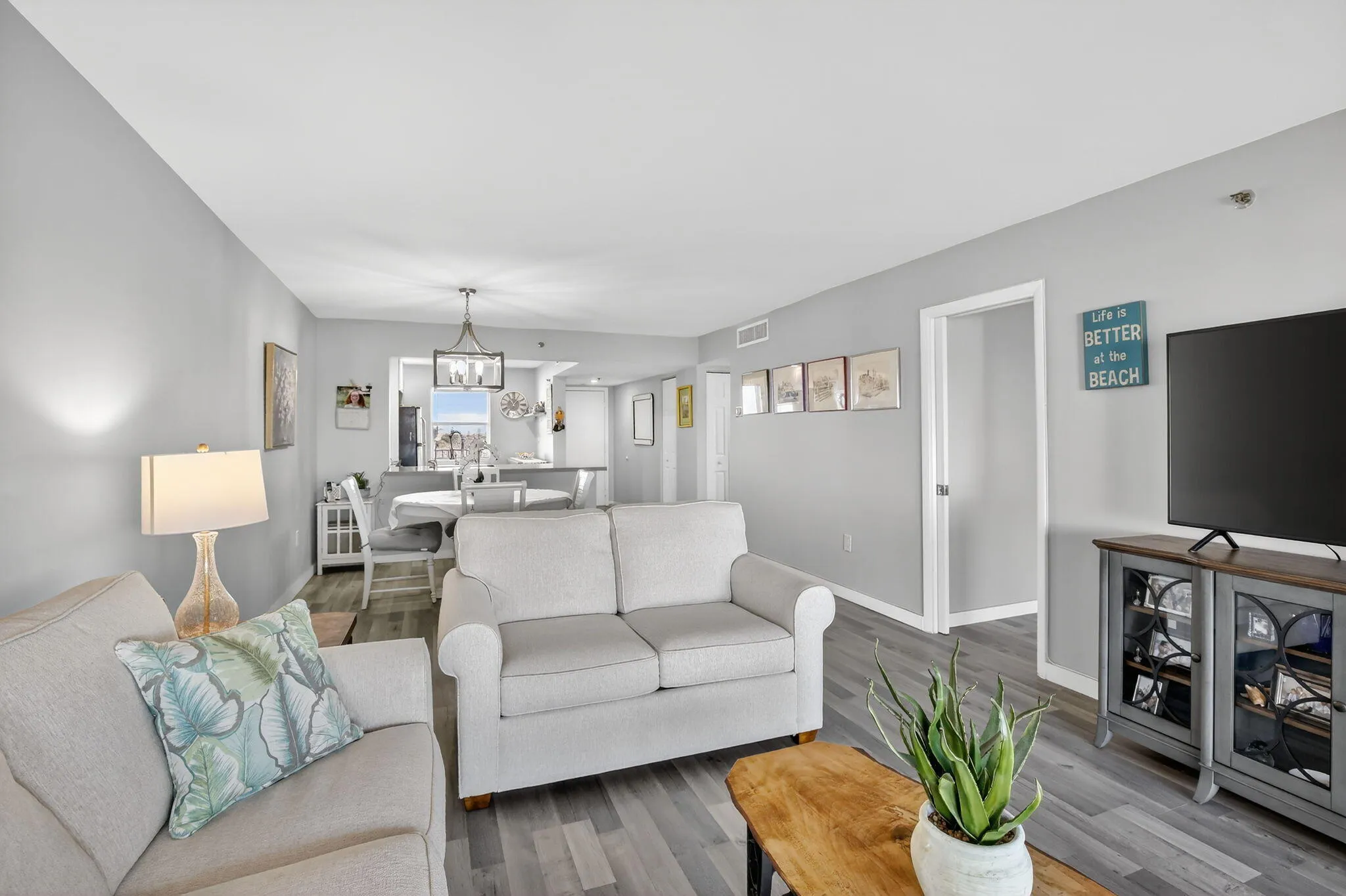 Living room area is light and bright with beautiful furnishings!