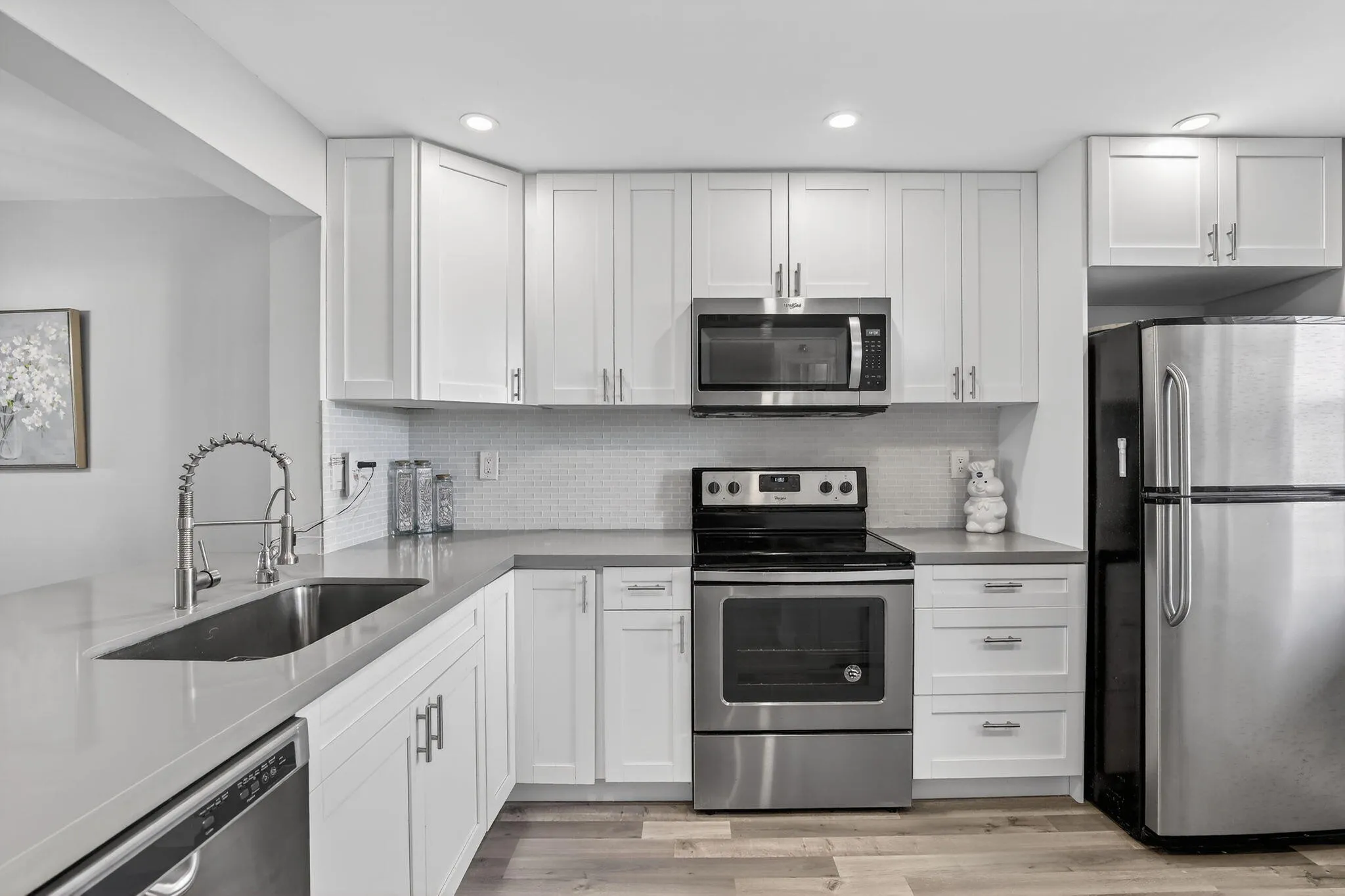 Modern, slate colored Quartz counters create a warm and inviting space!