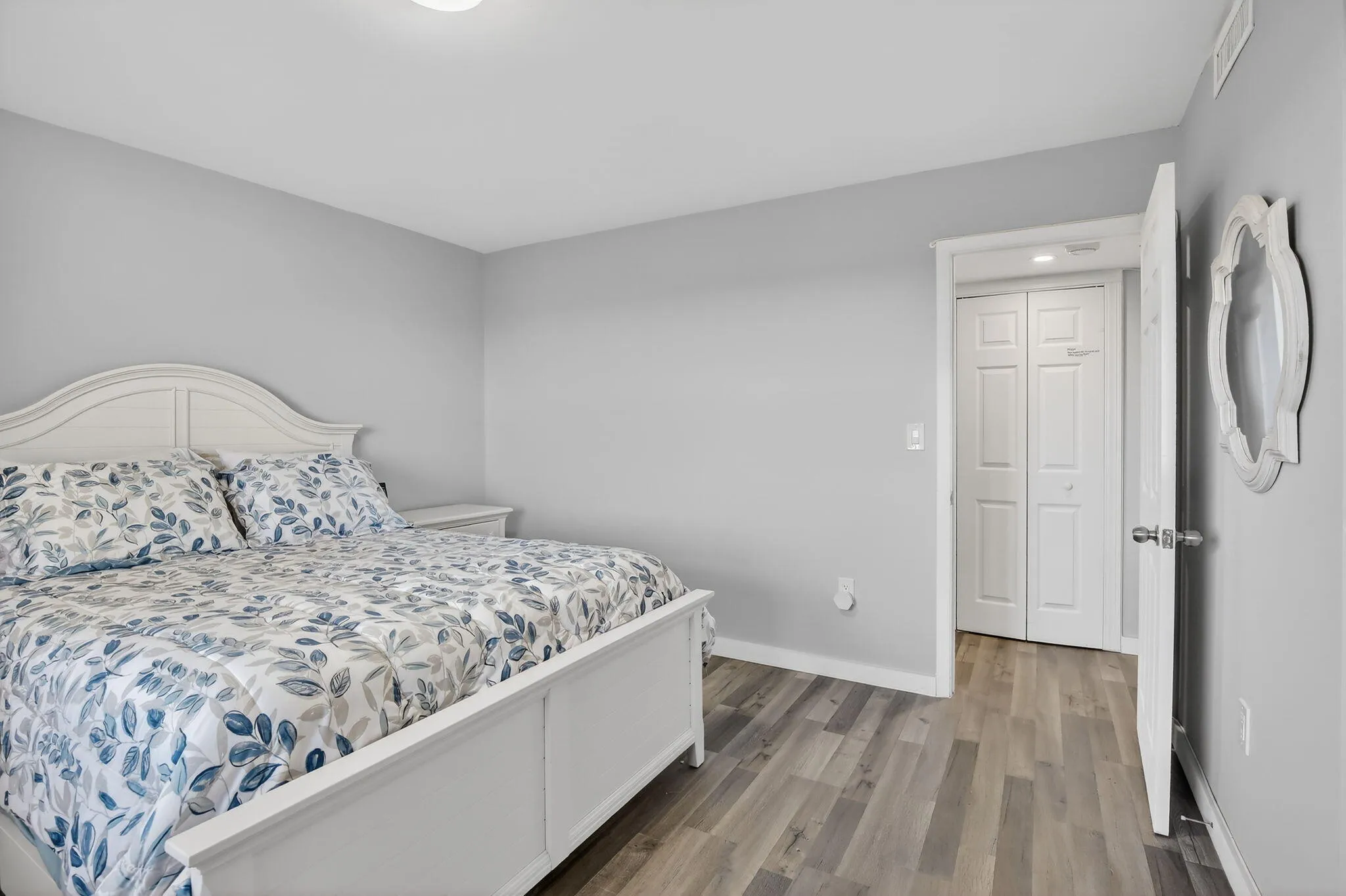 Guest bedroom features white, classic bedroom furniture matches any decor!