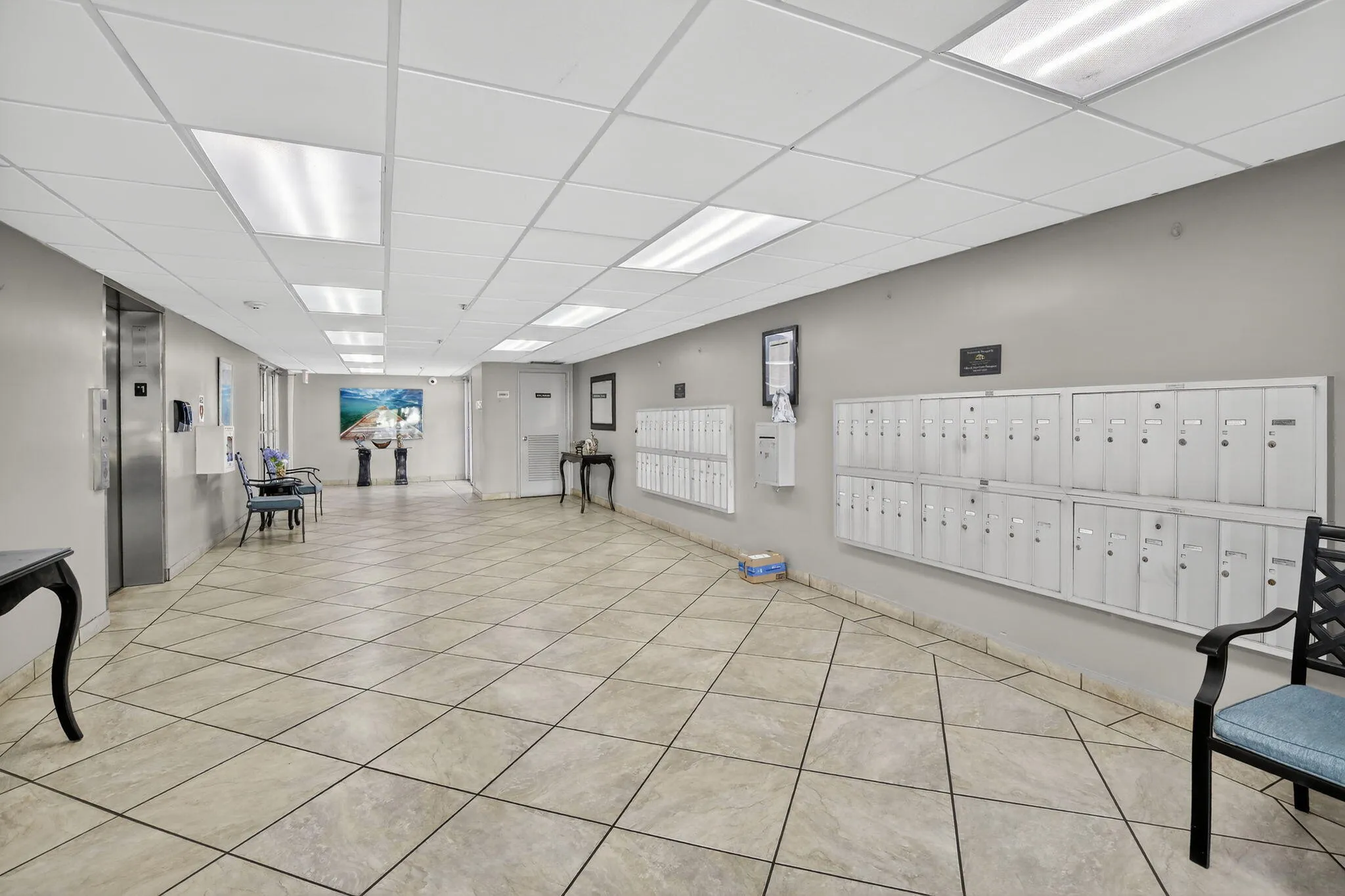 Well maintained lobby of the building holds the mailboxes and all those packages from Amazon!