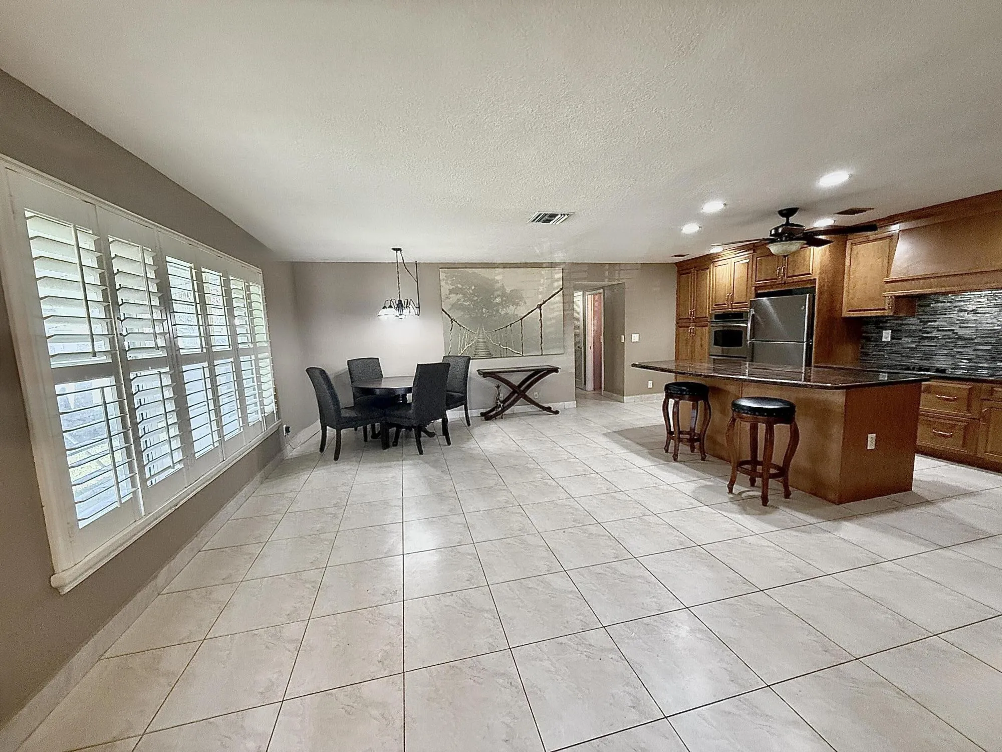 Living room and dining and bar at island