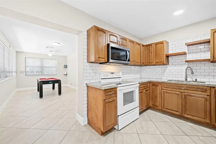 Kitchen with view to additional family room