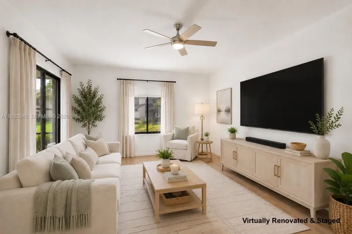 Option 2 of living room set up. Image virtually renovated & staged to help buyers visualize possible updates.