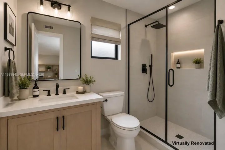 Second bathroom. Image virtually renovated & staged to help buyers visualize possible updates.