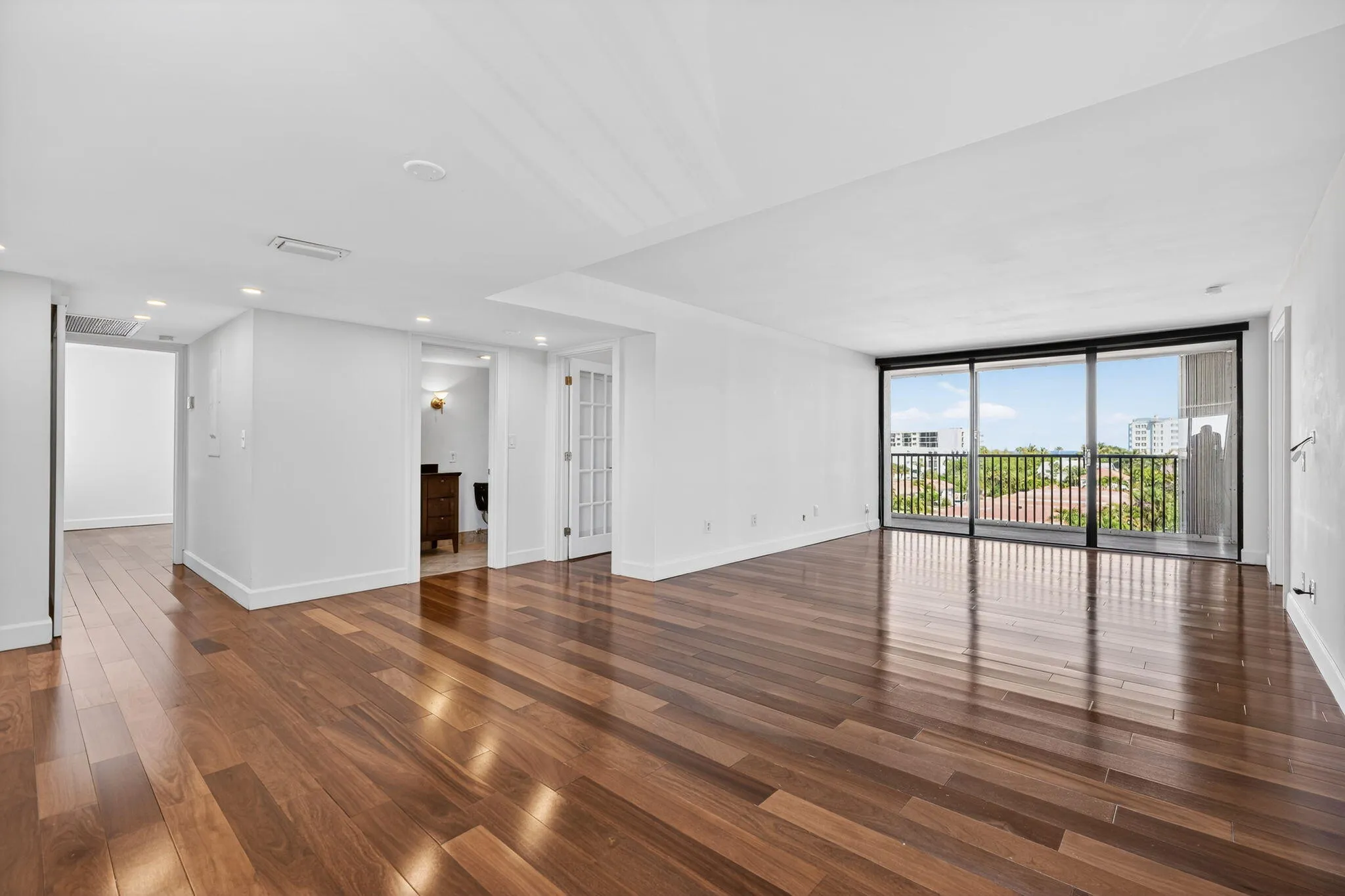 Living area, hallway to third bedroom and entrances to second full bathroom and second bedroom/office
