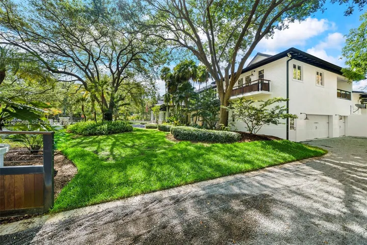Double gated entry and driveway to 2 car garage