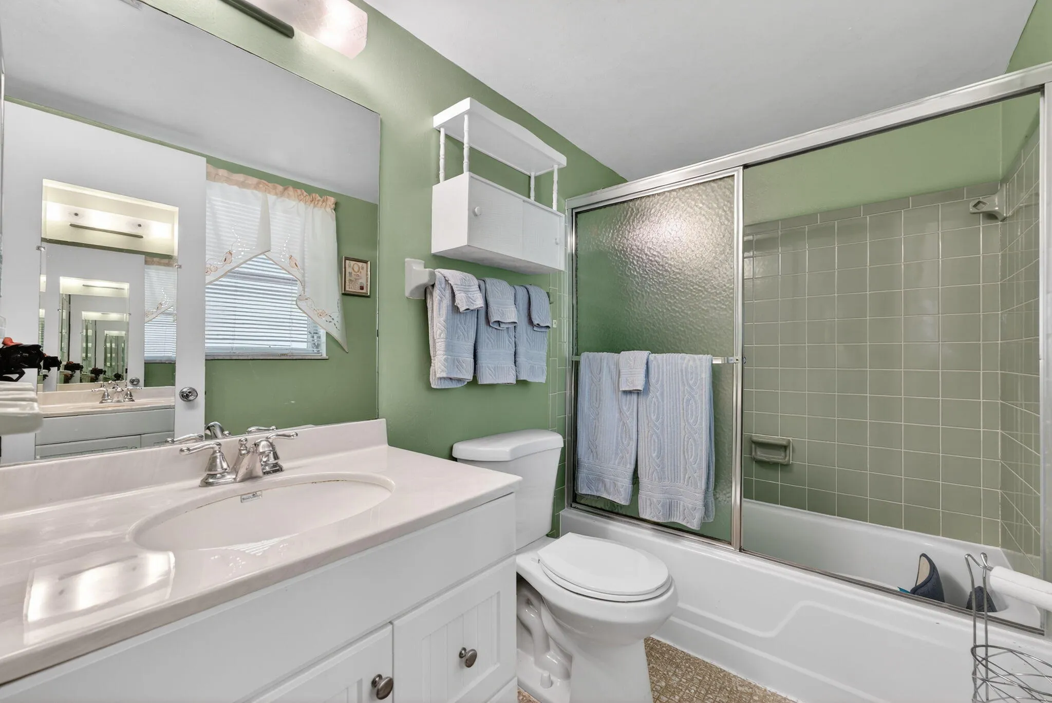 Primary Bathroom with Tub/Shower combo. New Vanity, Toilet and Fixtures.
