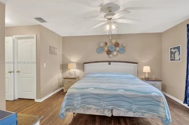 Waterproof wood-look flooring, ceiling fan, tall window